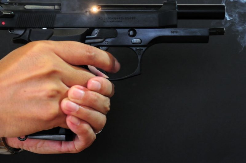 A close up shot of the Beretta M92 being held