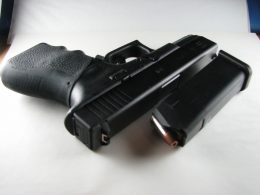 Glock 19 with a magazine and ammo
