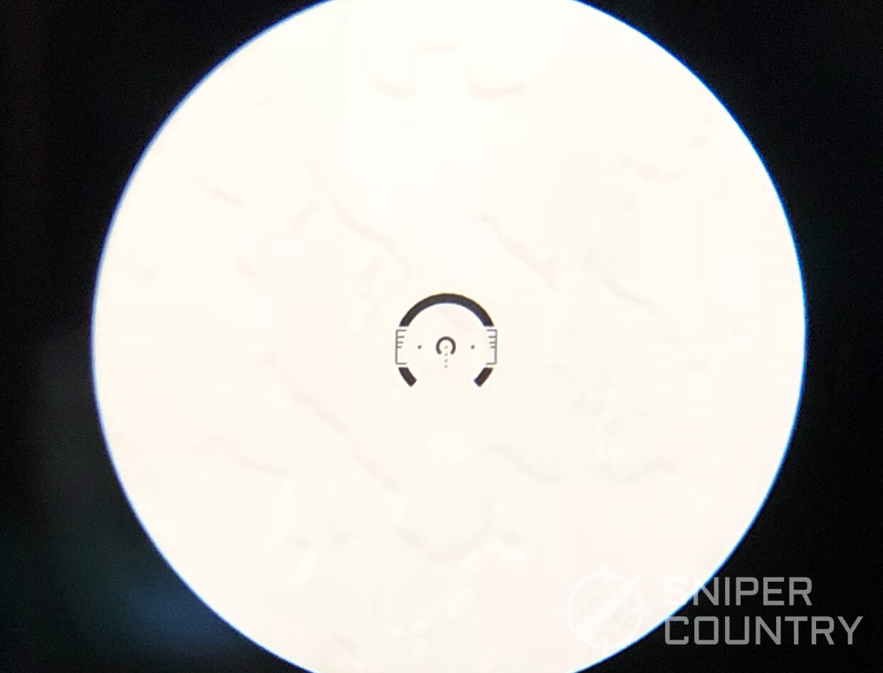 ACSS CQB-M Reticle on white background indoors