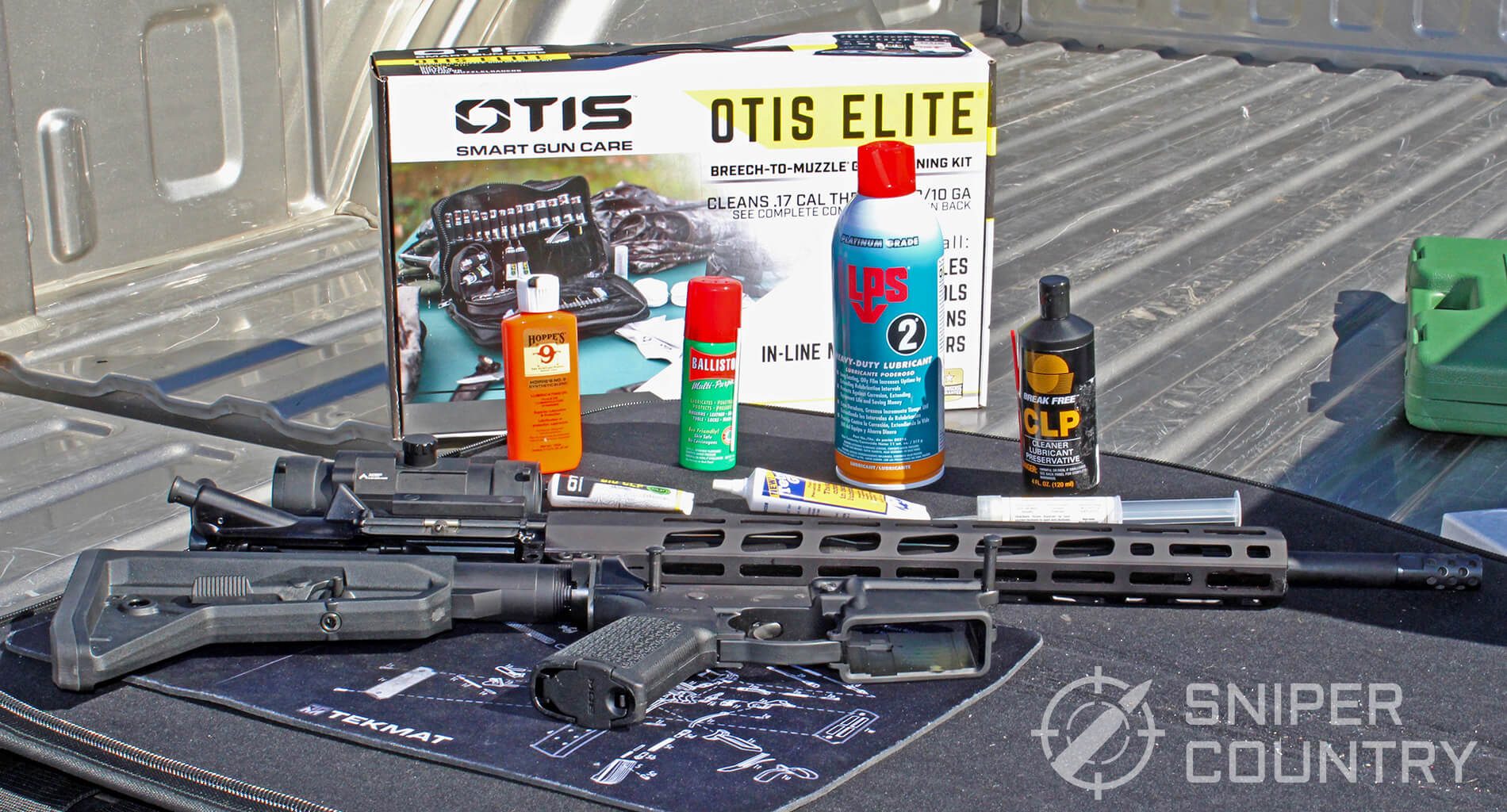 Gun oils and greases next to an AR-15