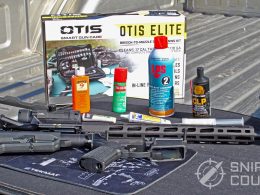 Gun oils and greases next to an AR-15