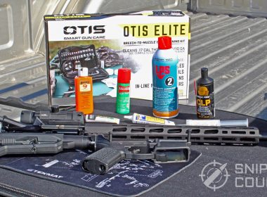 Gun oils and greases next to an AR-15