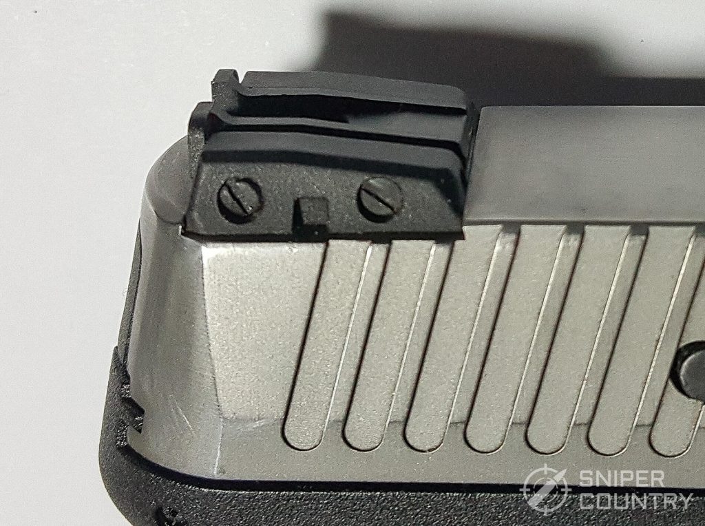 Rear sight adjustment screws: elevation (L); windage (R)