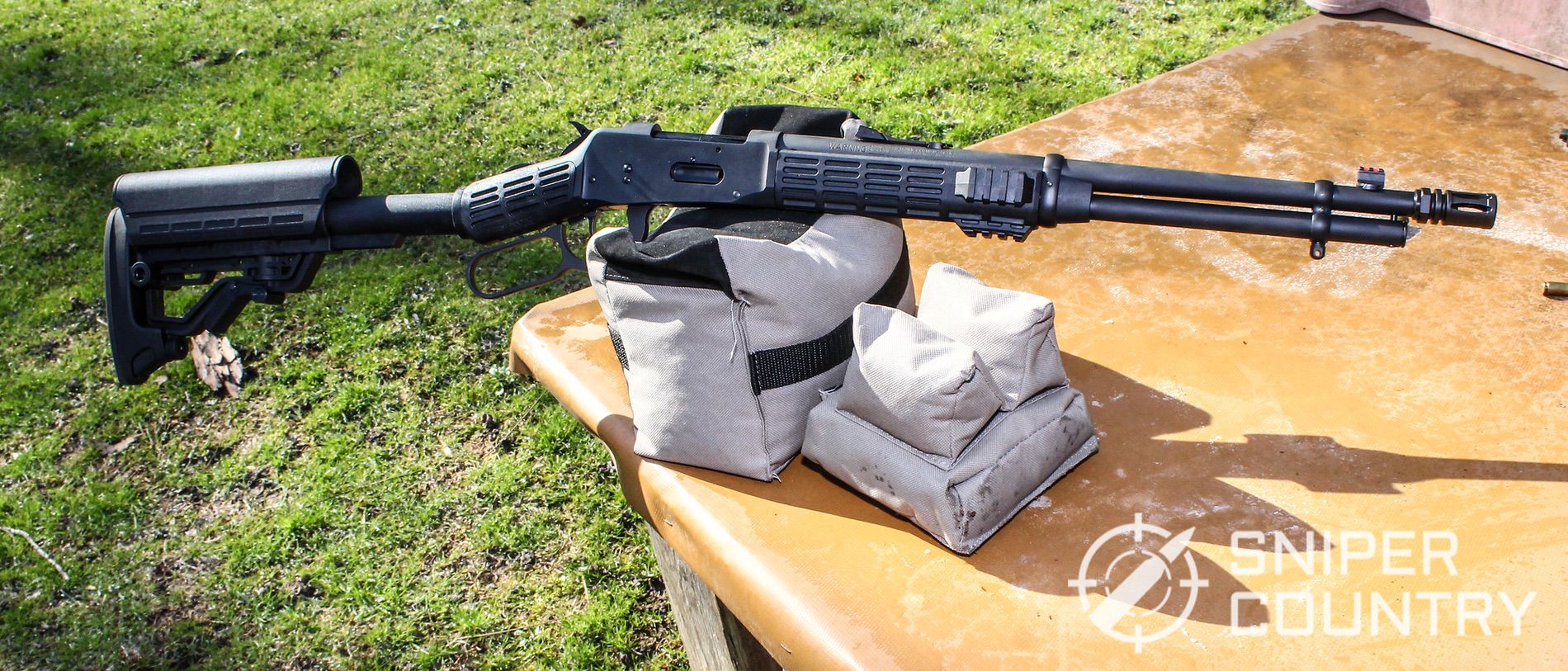 Title shot of the Mossberg 464 SPX on the gun bag
