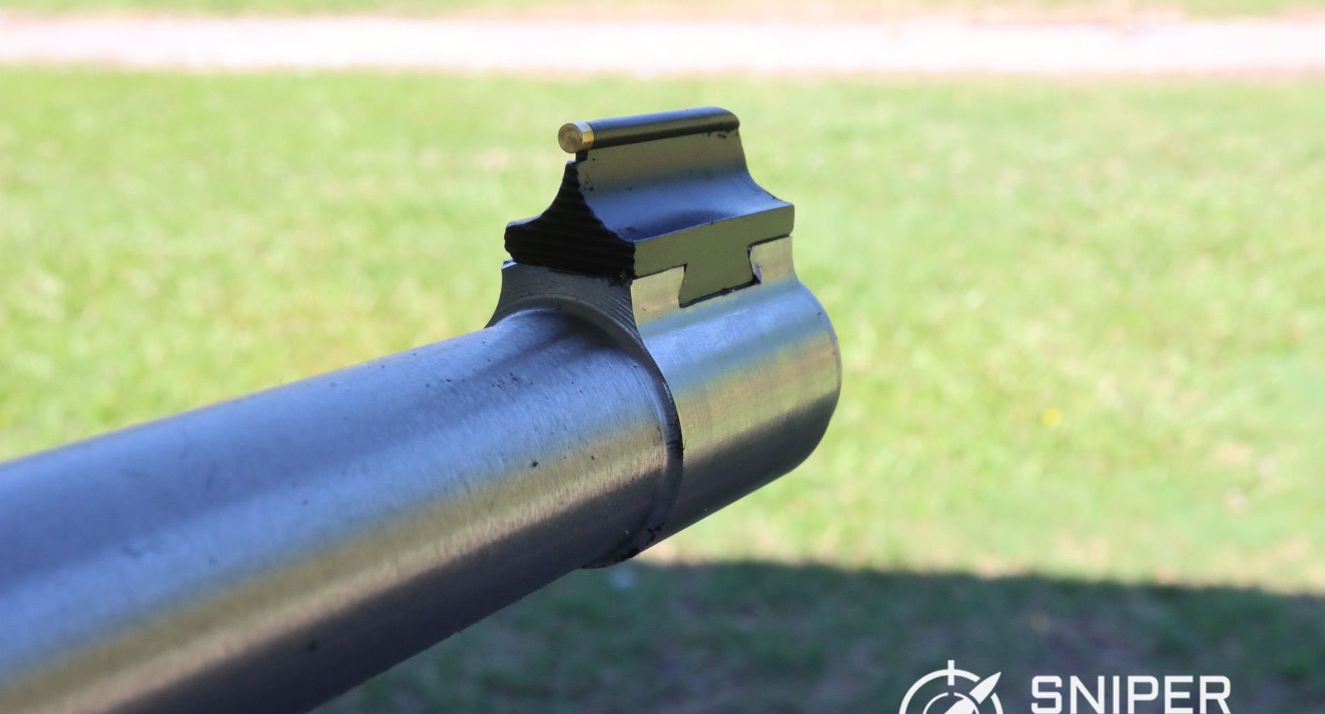 The business end of the Ruger 10:22 Takedown’s barrel, showing the dovetailed front sight. The brass dot provides a clear sight picture