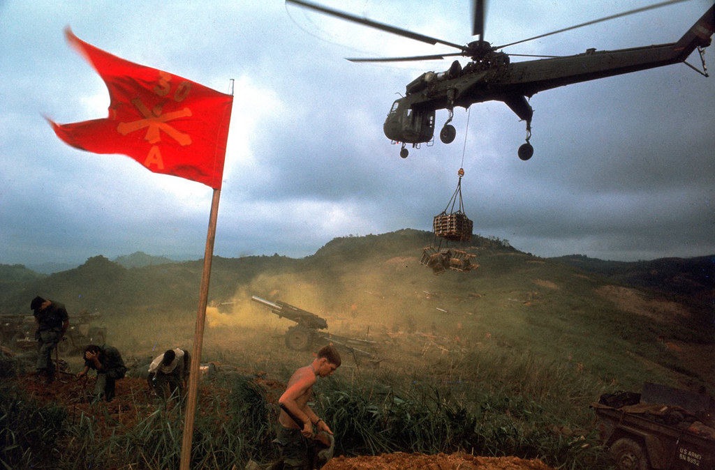 Vietnam War 1968 - An American 1st Air Cavalry helicopter airlifts supplies into a Marine outpost during Operation Pegasus