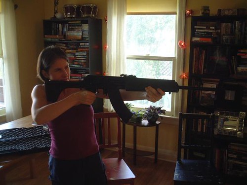 Best Gun for Home Defense Woman Holding Firearm