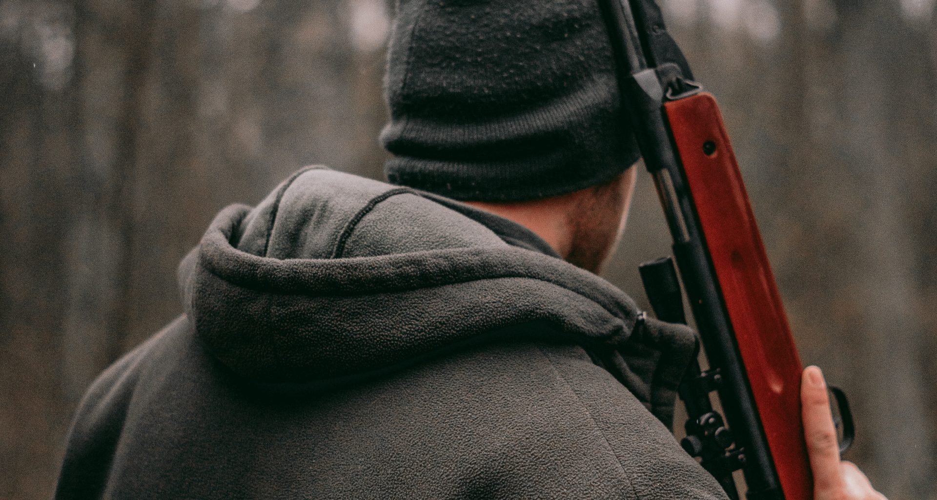 man with survival rifle