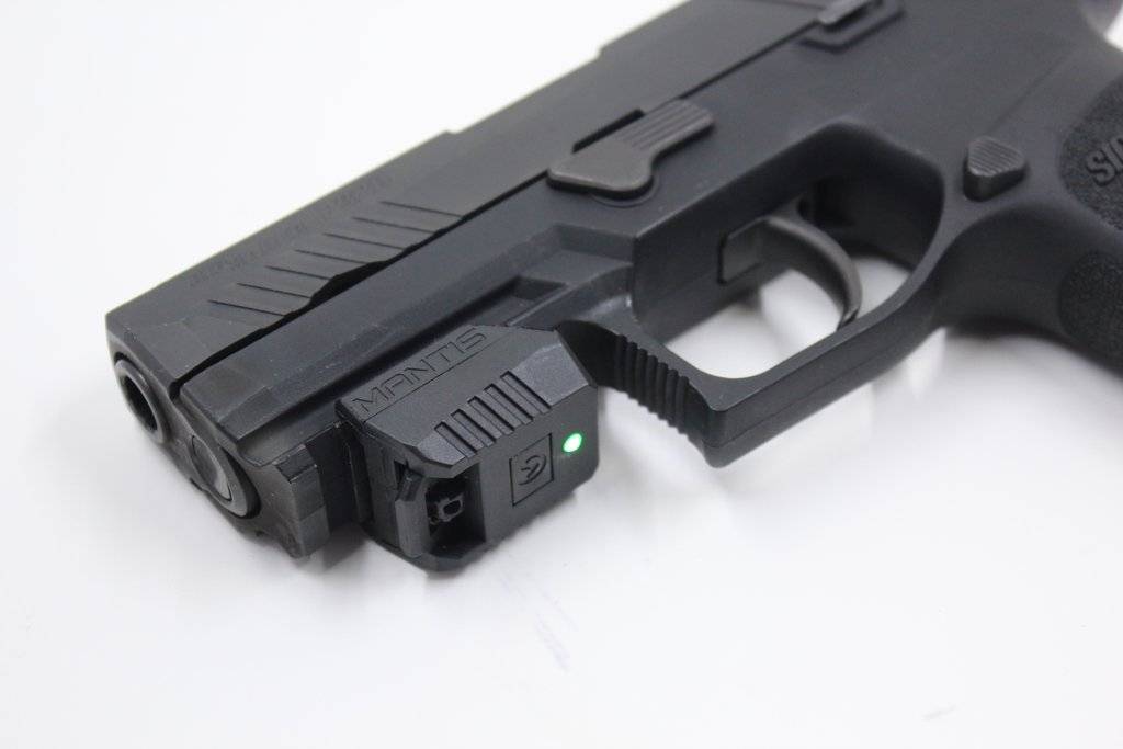 MantisX Review: Mantis X mounted on a handgun