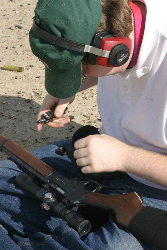 American shooter installing a Marlin 30-30 scope