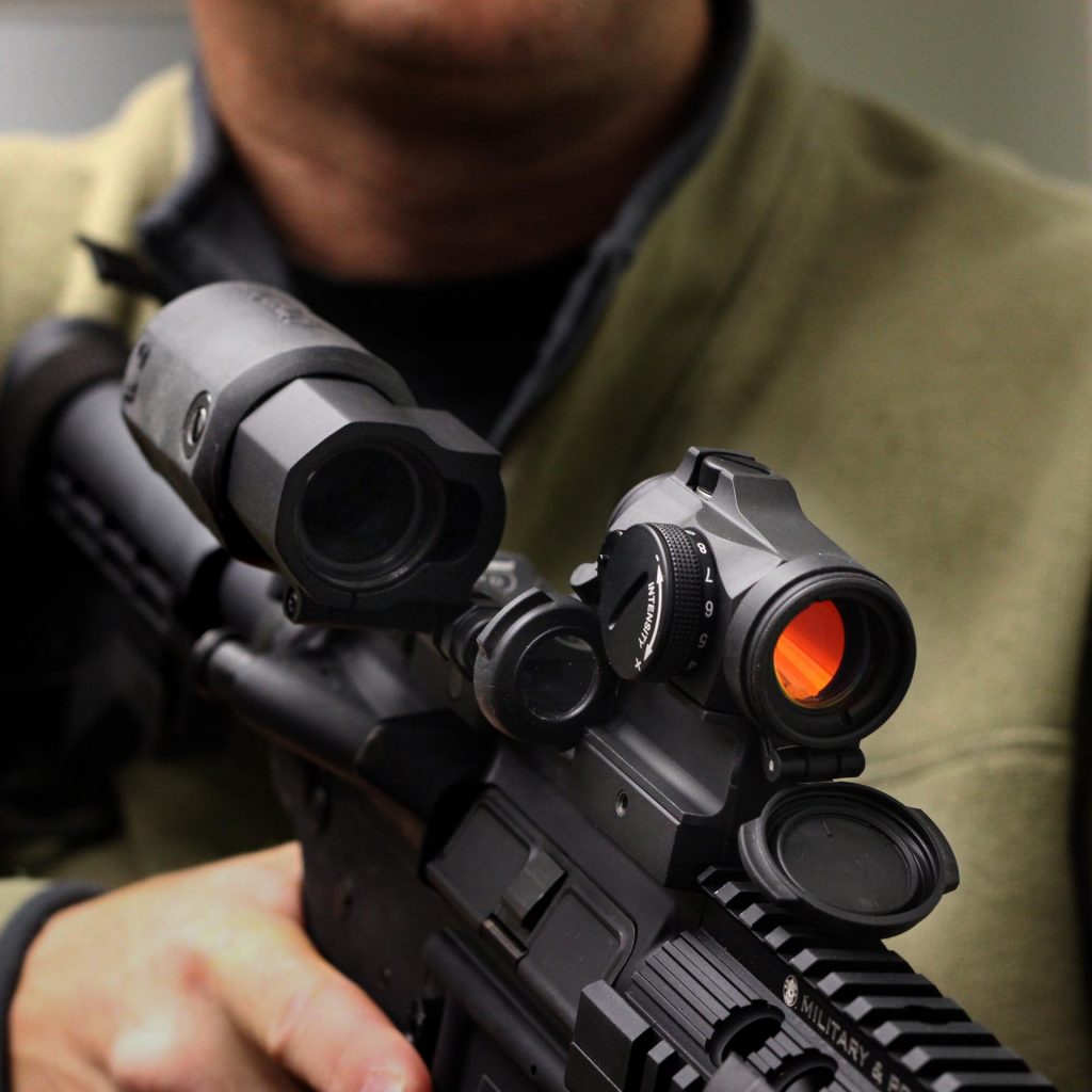 ar 15 scopes Aimpoint 3X-C behind an Aimpoint red dot